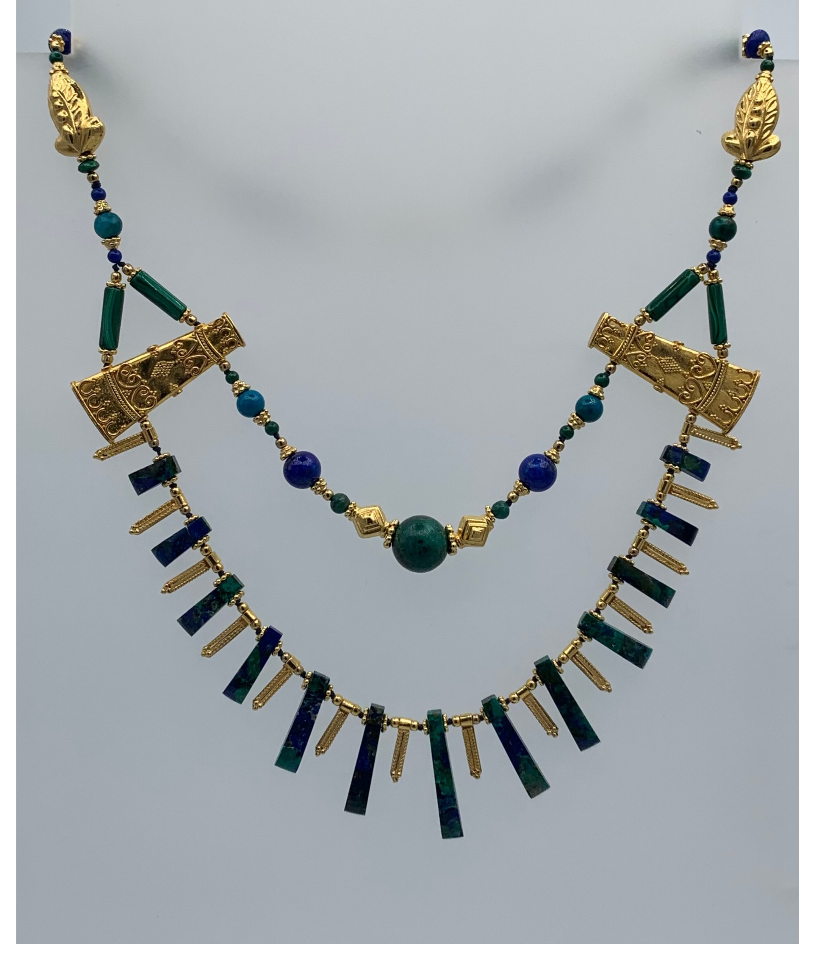 Ornate semi-precious hand knotted necklace of azurite, lapis and malachite with gold plated silver.